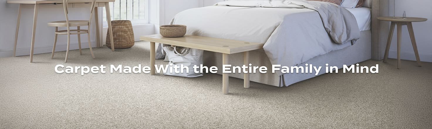 Godfrey Hirst SmartStrand Carpet in a modern bedroom with text "Carpet made with the entire family in mind"